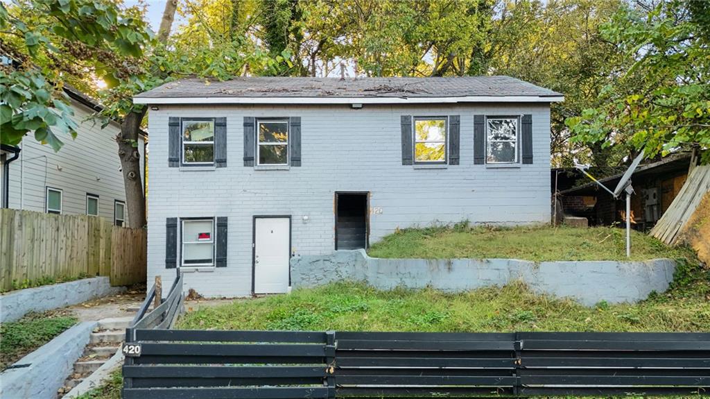 420 Griffin Street Northwest Atlanta, GA 30318 - Photo 1 of 40 a front view of a house with garden