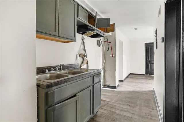 a bath tub sitting next to a shower
