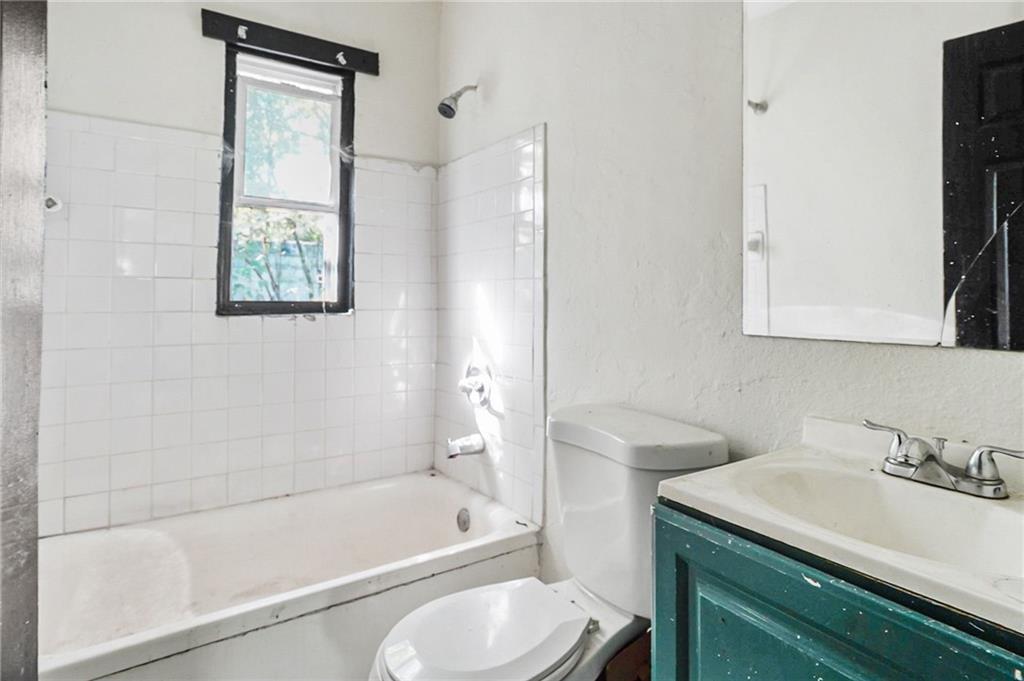 420 Griffin Street Northwest Atlanta, GA 30318 - Photo 17 of 40 a bathroom with a sink toilet and shower
