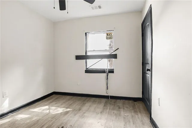 a living room with a bed furniture and a window