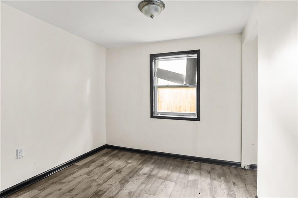 420 Griffin Street Northwest Atlanta, GA 30318 - Photo 20 of 40 an empty room with wooden floor and windows
