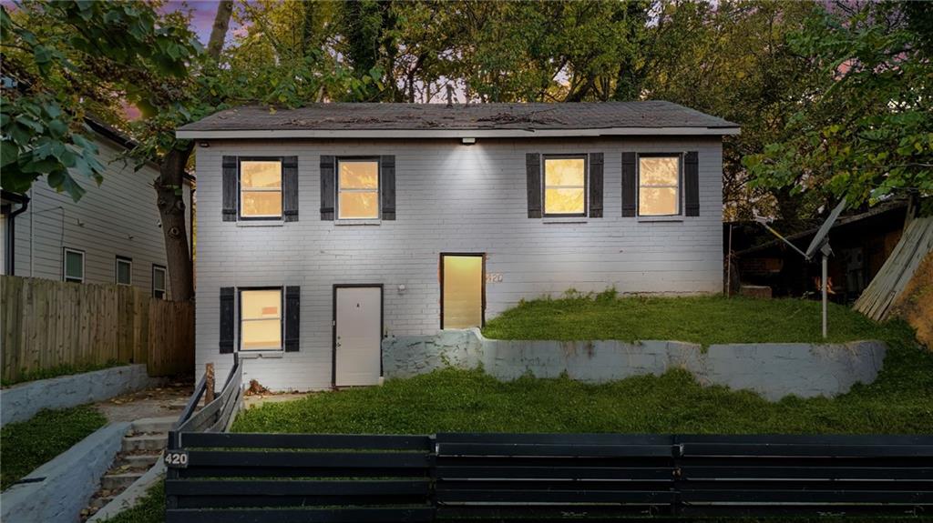 420 Griffin Street Northwest Atlanta, GA 30318 - Photo 2 of 40 a front view of a house with garden