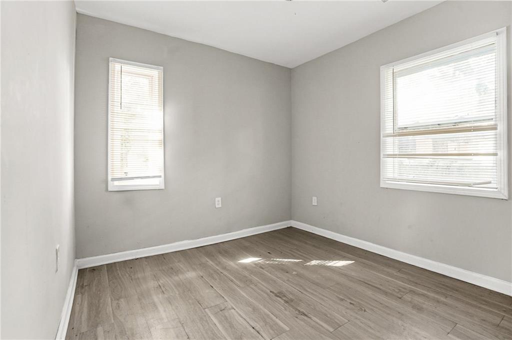 420 Griffin Street Northwest Atlanta, GA 30318 - Photo 24 of 40 an empty room with wooden floor and windows