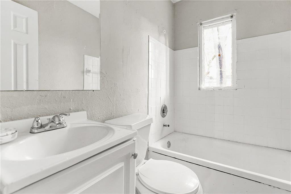 420 Griffin Street Northwest Atlanta, GA 30318 - Photo 29 of 40 a bathroom with a sink toilet and shower