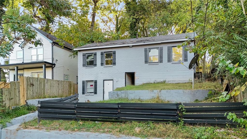 420 Griffin Street Northwest Atlanta, GA 30318 - Photo 3 of 40 a front view of a house with garden and trees