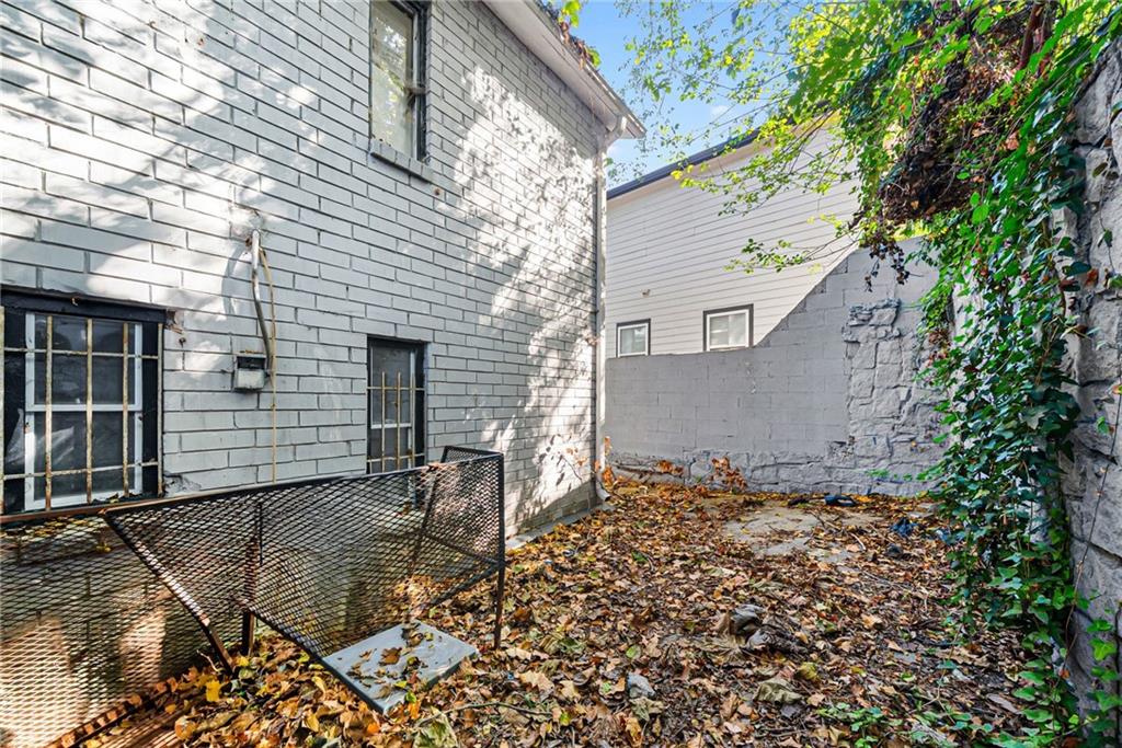 420 Griffin Street Northwest Atlanta, GA 30318 - Photo 33 of 40 front view of a house with a bench