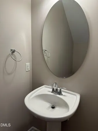 a bathroom with a sink and mirror