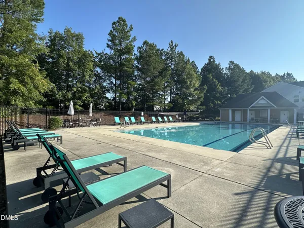 a view of a patio with chairs and a table