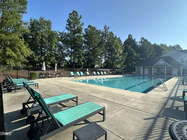 a view of a patio with chairs and a table