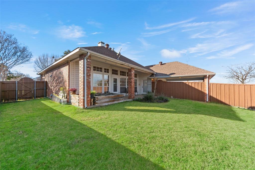 3308 North Spring Drive Richardson, TX 75082 - Photo 29 of 38 The private backyard offers a perfect blend of relaxation and entertainment. A spacious covered patio provides shade and comfort for outdoor dining or quiet mornings with coffee. Beautifully maintained flower beds add color and charm, while the raised koi ponds create a tranquil focal point and unique conversation piece. With plenty of grassy space for play or pets, this backyard is designed for both peaceful enjoyment and memorable gatherings.