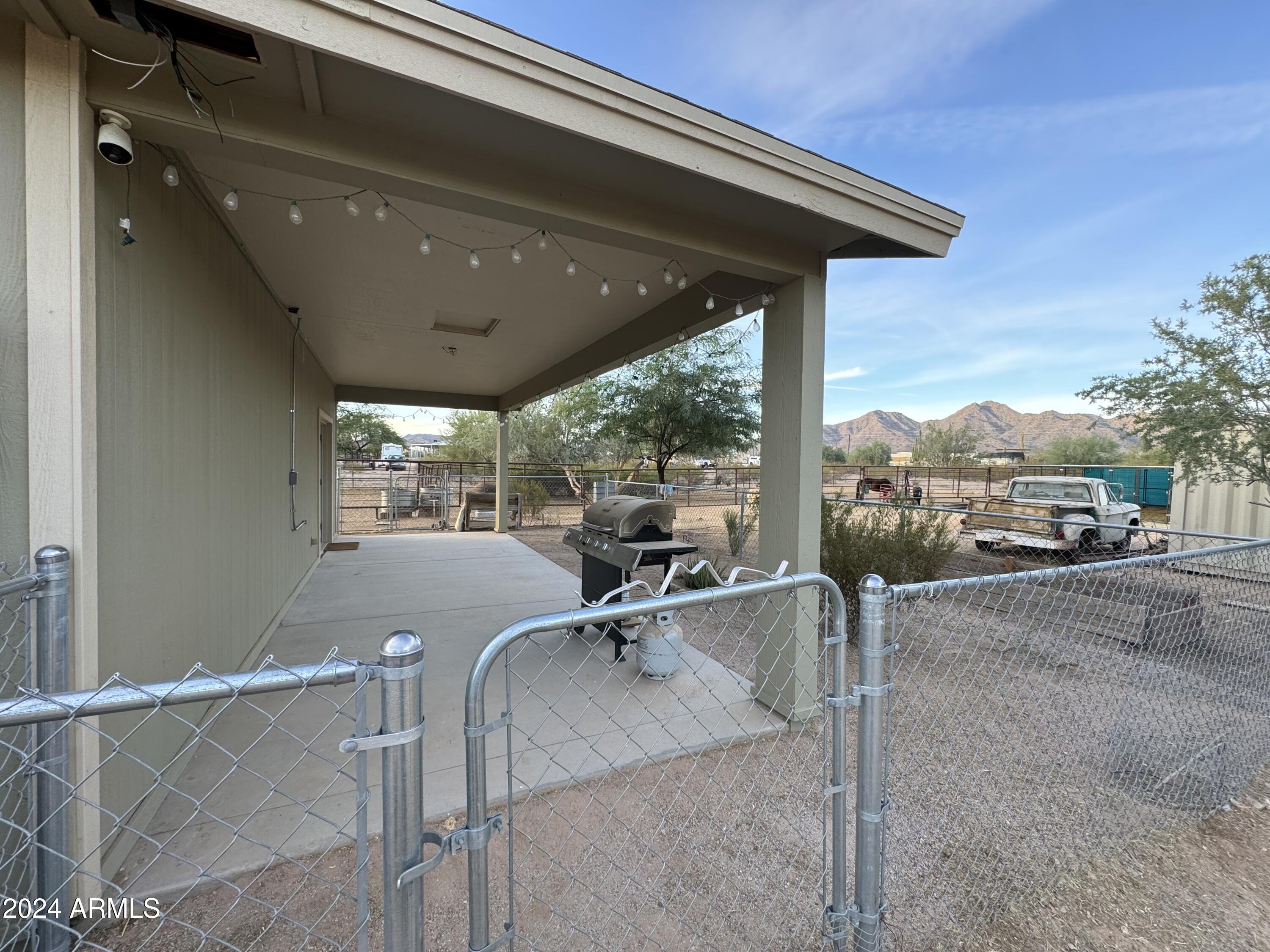 34470 North Sossaman Road San Tan Valley, AZ 85144 - Photo 12 of 12 a view of a patio with a table and chairs