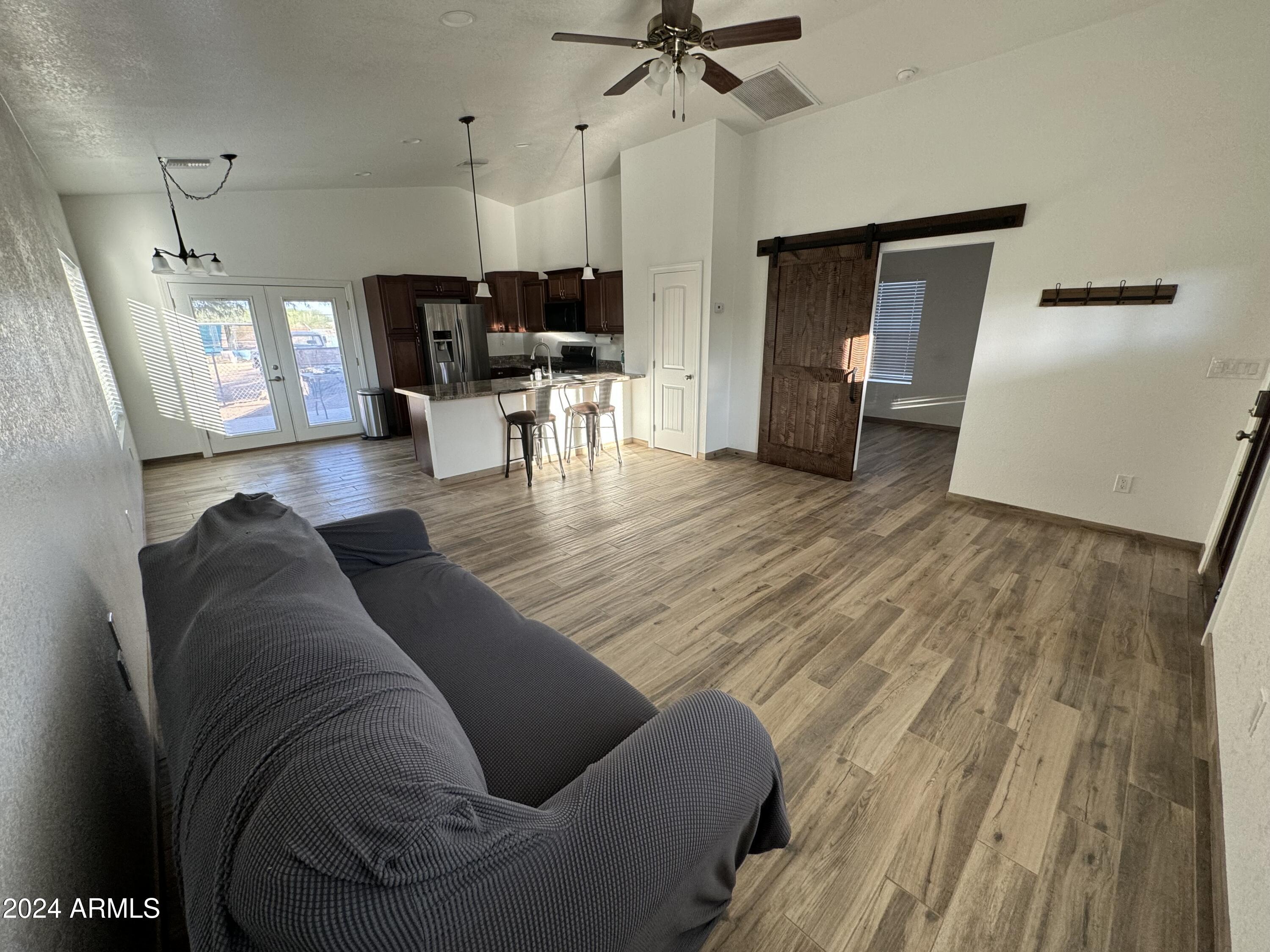 34470 North Sossaman Road San Tan Valley, AZ 85144 - Photo 4 of 12 a living room with furniture and wooden floor