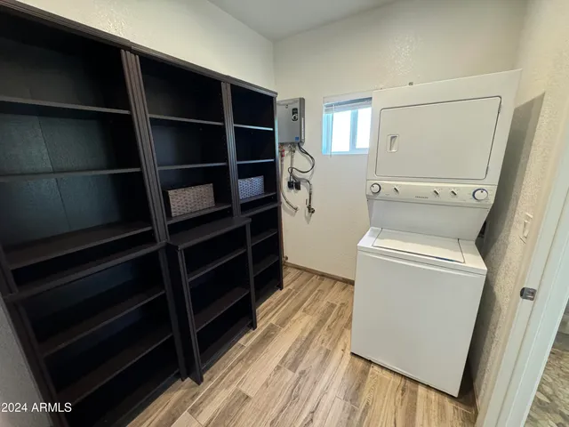 a view of walk in closet with empty racks