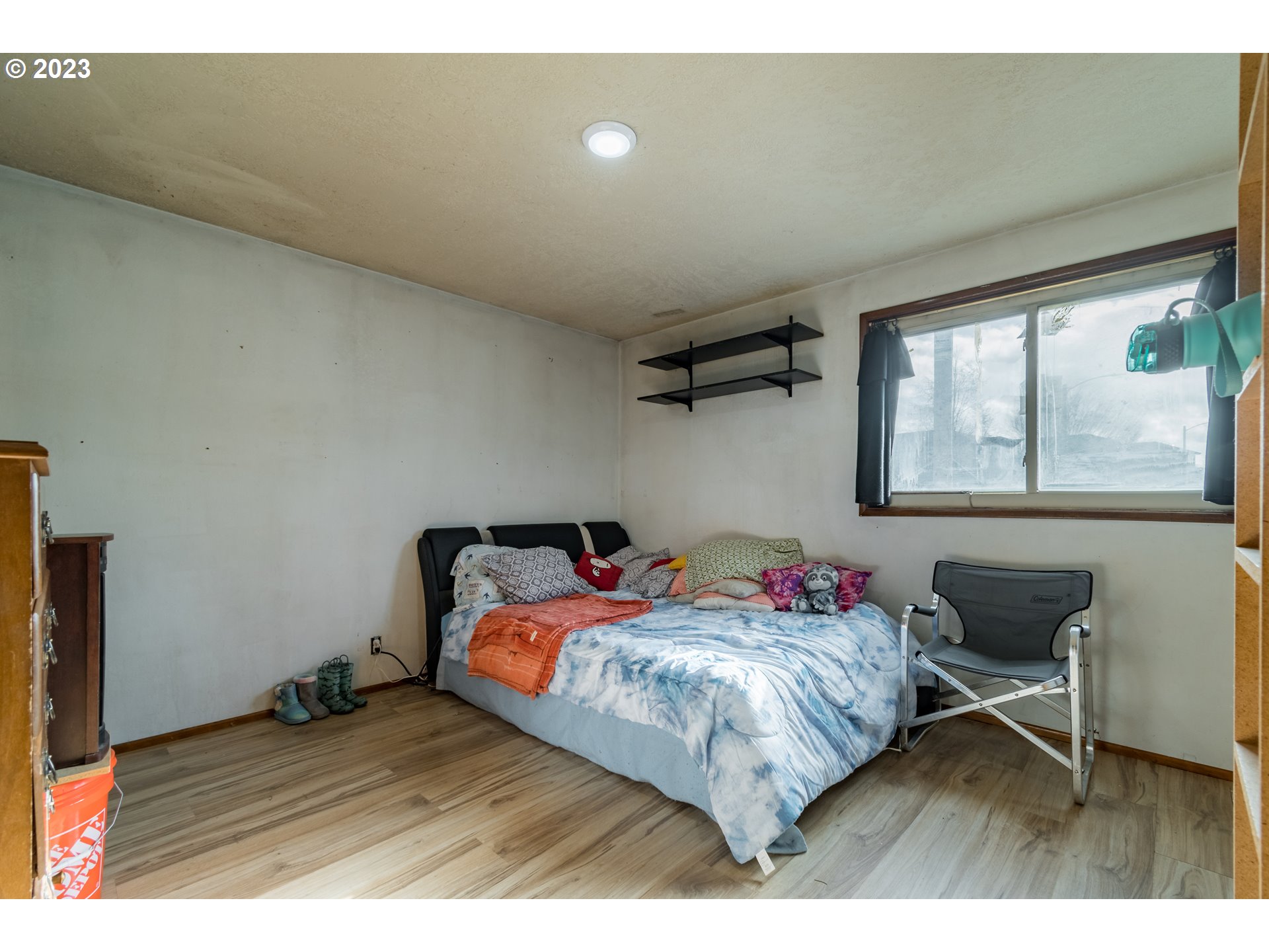 300 S Street Springfield, OR 97477 - Photo 15 of 26 a bedroom with a bed and a table in it