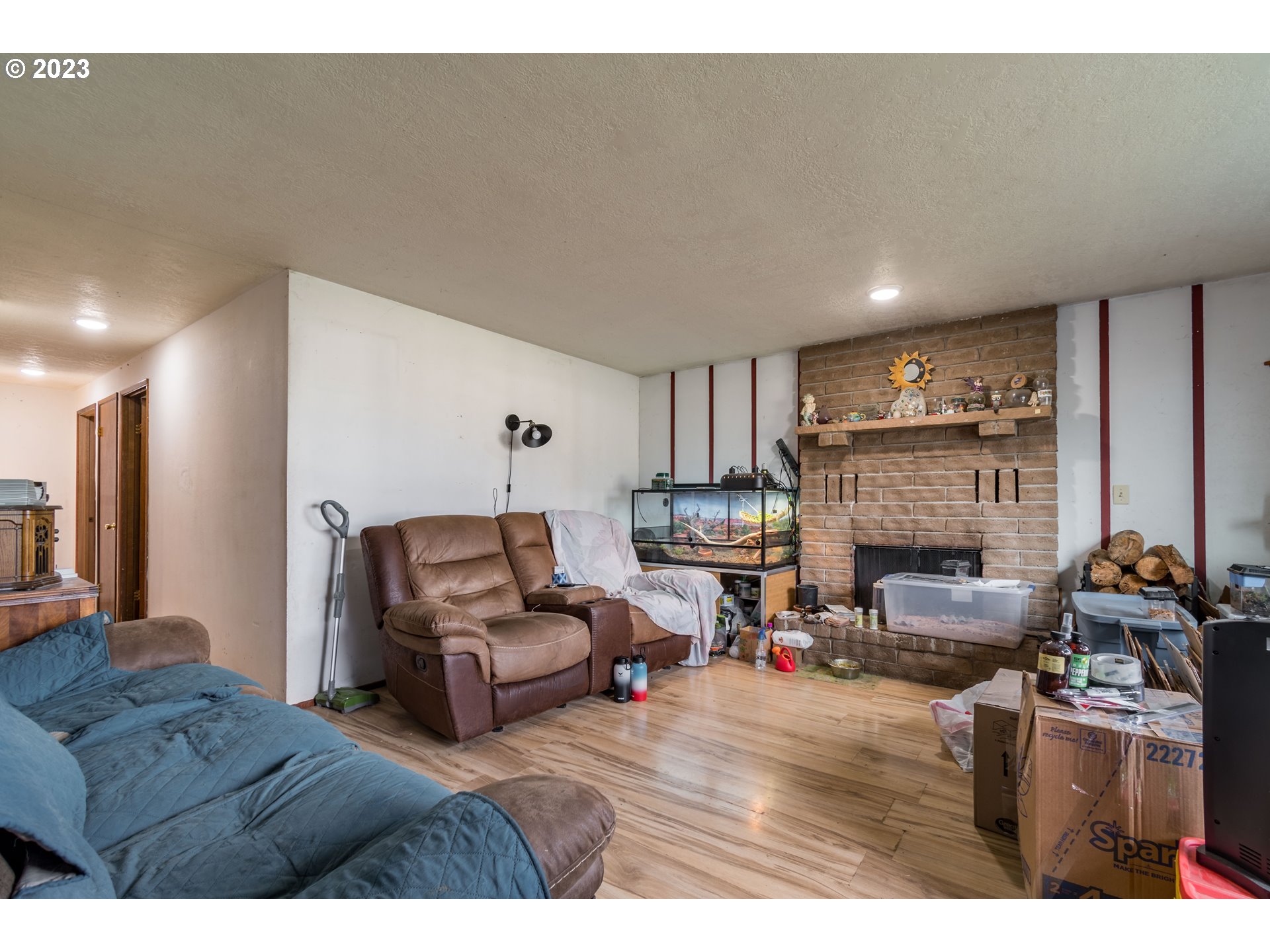 300 S Street Springfield, OR 97477 - Photo 9 of 26 a living room with furniture and a fireplace