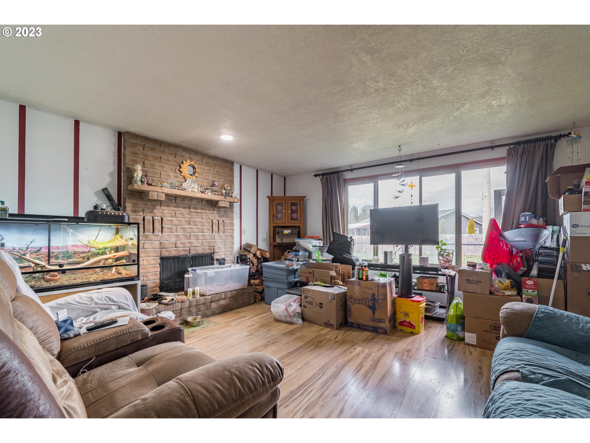 300 S Street Springfield, OR 97477 - Photo 10 of 26 a living room with furniture and a flat screen tv