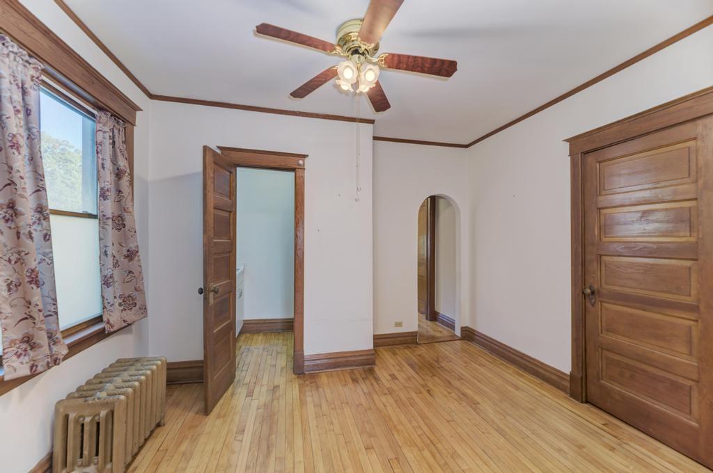 8611 Archer Avenue Willow Springs, IL 60480 - Photo 16 of 37 a view of room with window and wooden floor