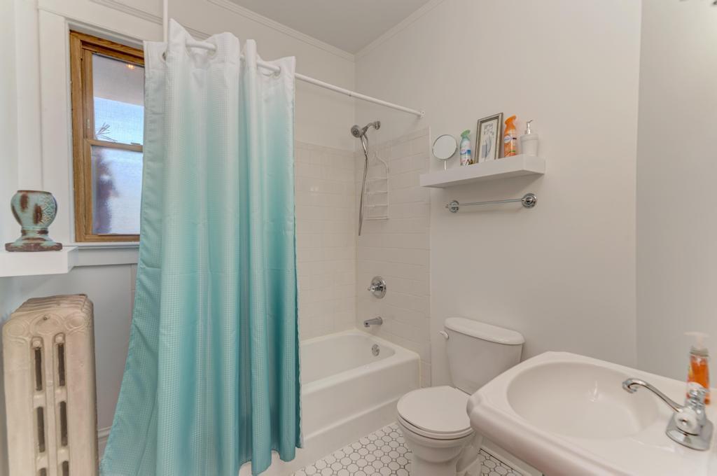 8611 Archer Avenue Willow Springs, IL 60480 - Photo 18 of 37 a bathroom with a toilet and a bathtub