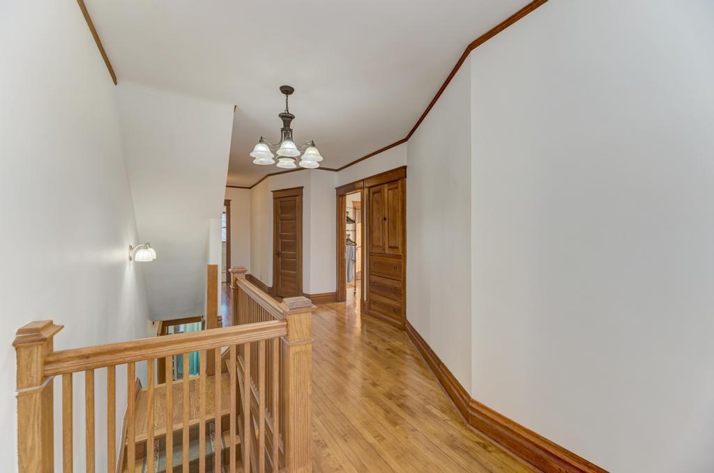 8611 Archer Avenue Willow Springs, IL 60480 - Photo 20 of 37 a view of a hallway with wooden floor and staircase