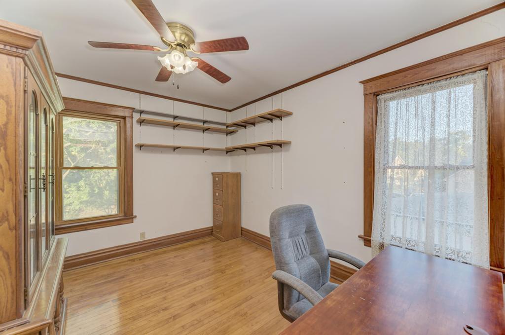 8611 Archer Avenue Willow Springs, IL 60480 - Photo 28 of 37 a view of a workspace with furniture and a window