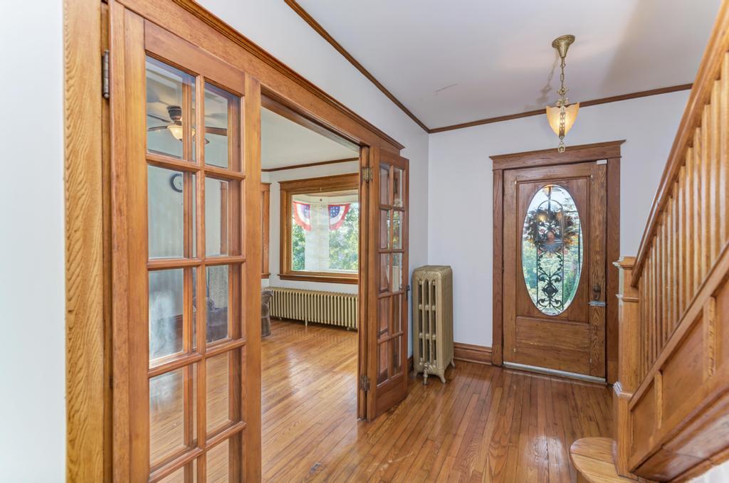 8611 Archer Avenue Willow Springs, IL 60480 - Photo 6 of 37 a view of a hallway with wooden floor and a window