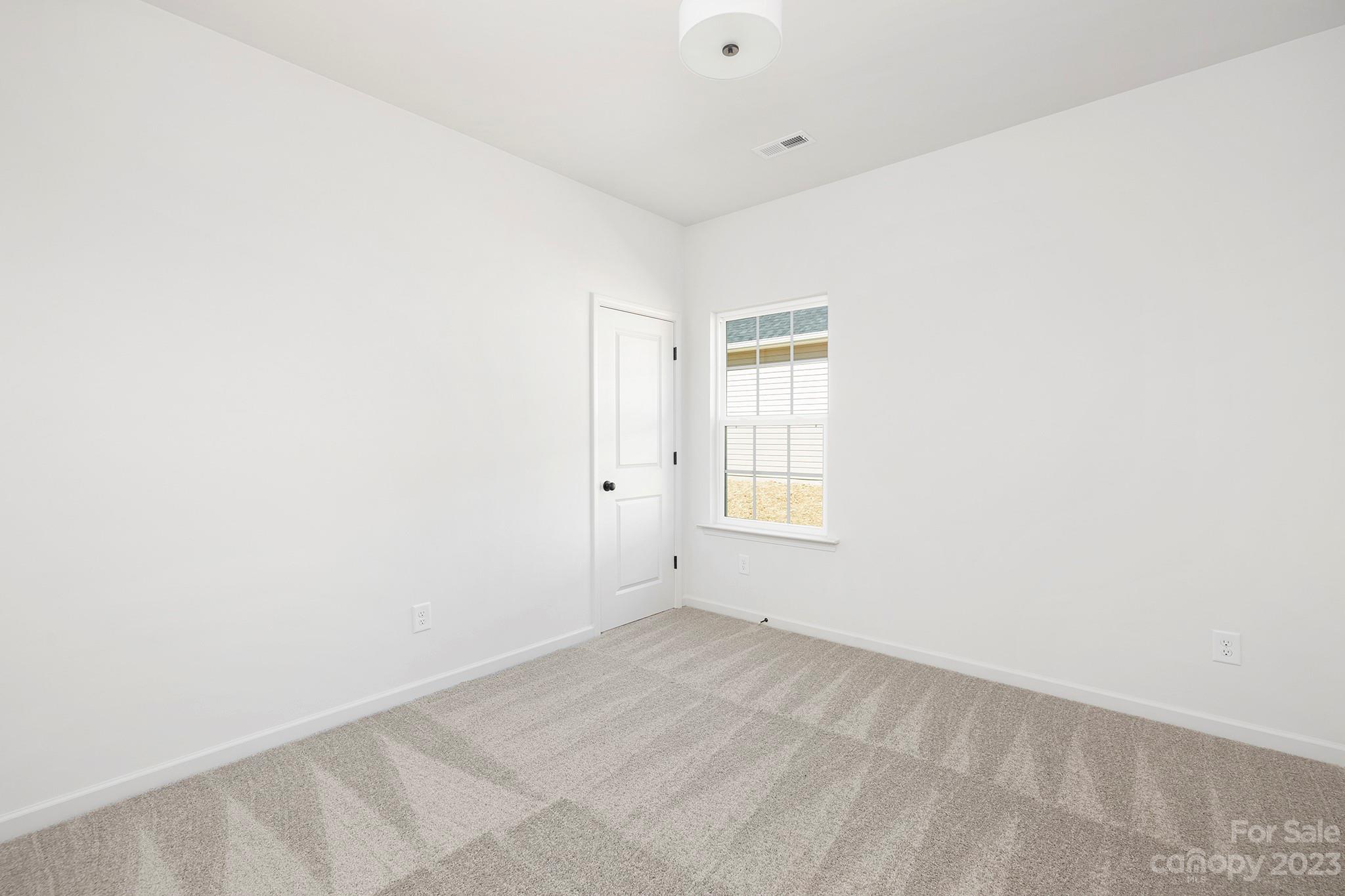 841 McDonald Road Charlotte, NC 28214 - Photo 13 of 16 an empty room with a window