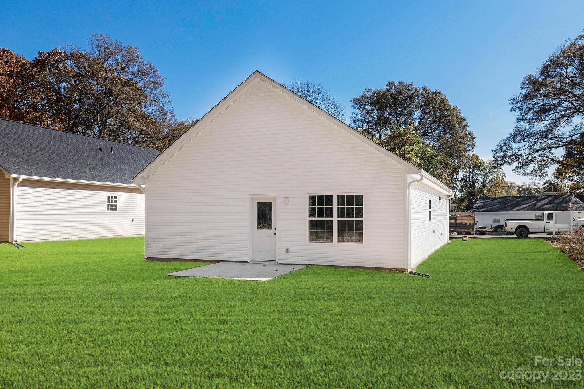 841 McDonald Road Charlotte, NC 28214 - Photo 16 of 16 a view of a backyard with plants and large trees
