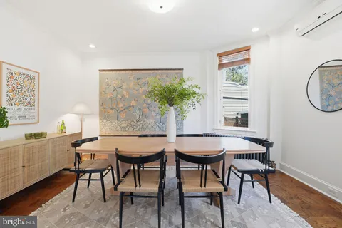 a view of a dining room with furniture and window