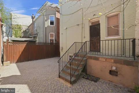 a view of a balcony with wooden floor