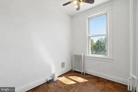 a kitchen with stainless steel appliances granite countertop a sink a stove and a refrigerator with wooden cabinets