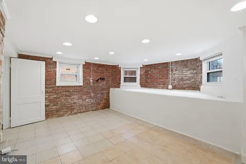 a view of an empty room with a fireplace