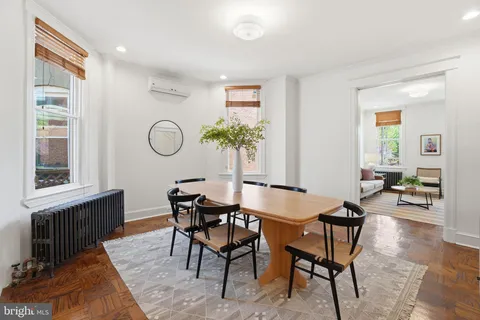 a view of a dining room with furniture and window