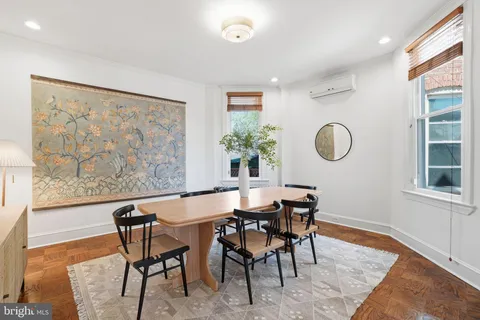 a view of a dining room with furniture and window