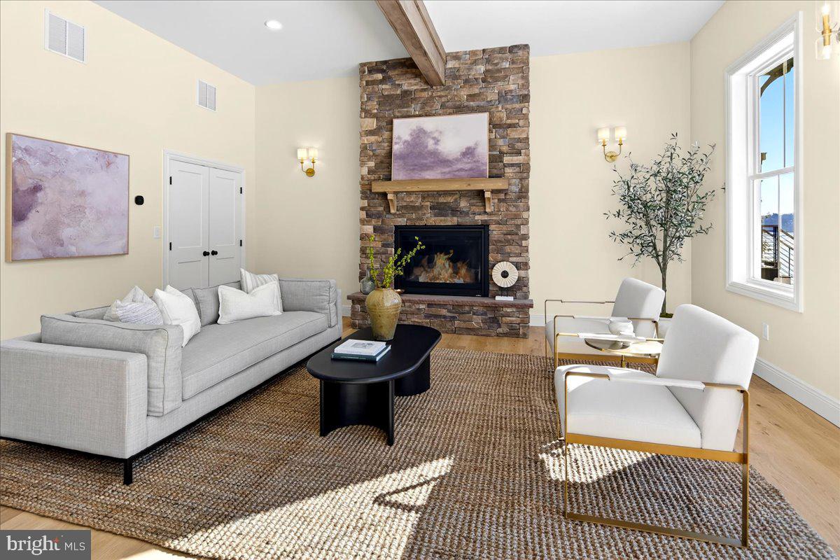 159 Byram Lane Stockton, NJ 08559 - Photo 12 of 62 a living room with furniture and a fireplace