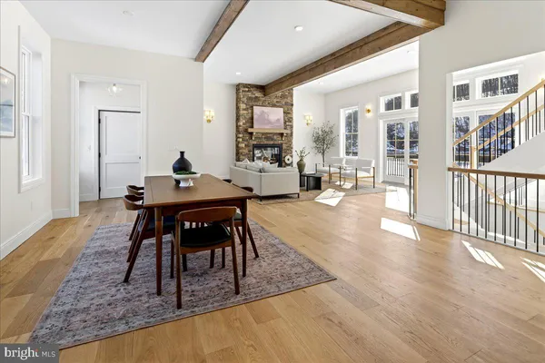 a living room with furniture and a window with wooden floor
