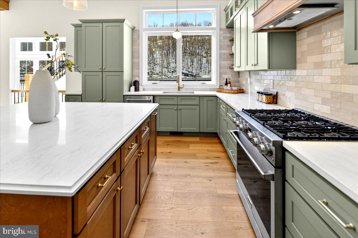159 Byram Lane Stockton, NJ 08559 - Photo 24 of 62 a kitchen with stainless steel appliances granite countertop a sink and stove
