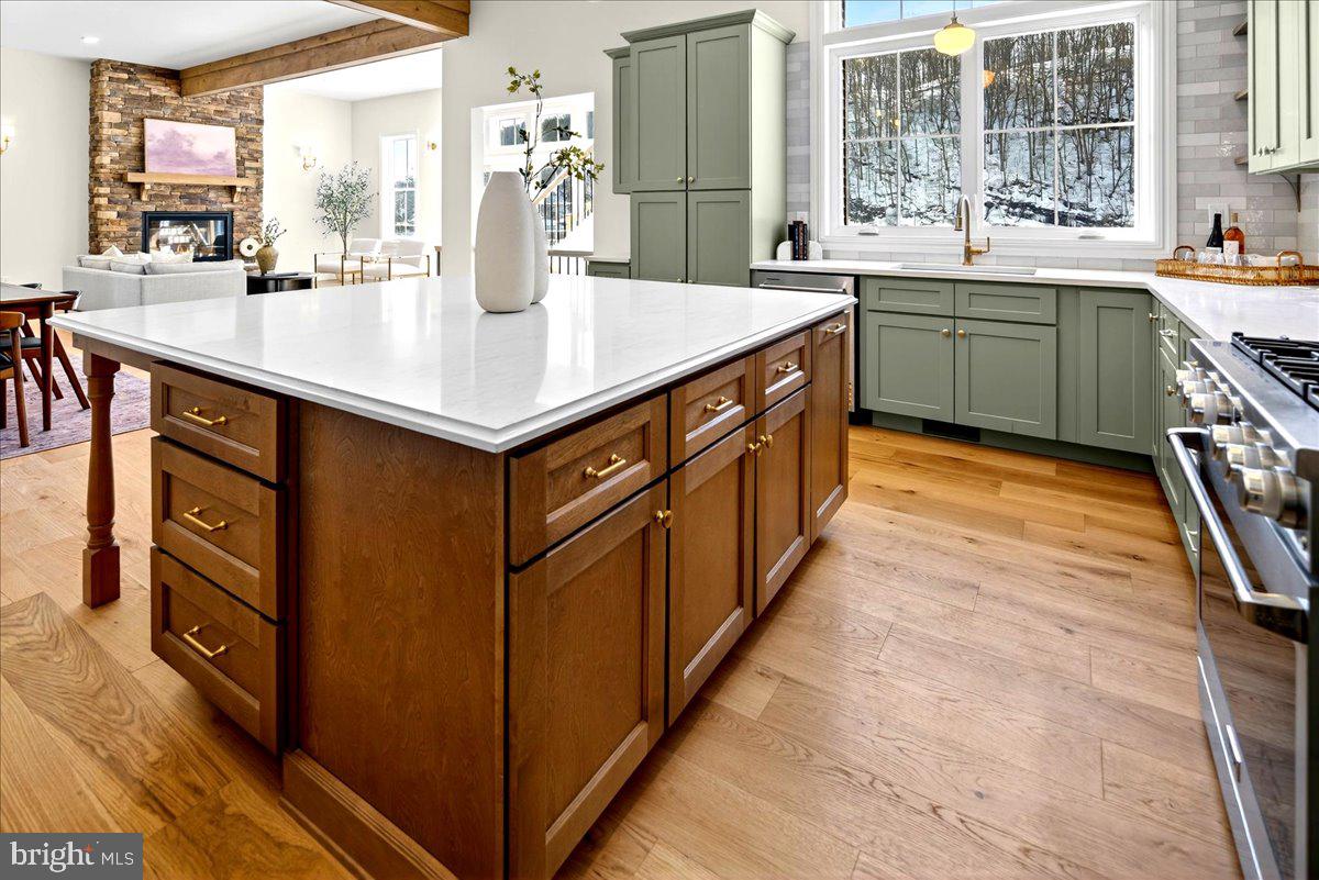 159 Byram Lane Stockton, NJ 08559 - Photo 27 of 62 a kitchen with stainless steel appliances kitchen island granite countertop a sink and a large window
