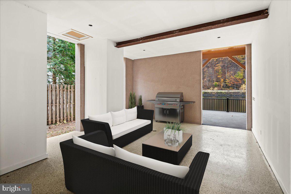 159 Byram Lane Stockton, NJ 08559 - Photo 49 of 62 a living room with furniture and a large window