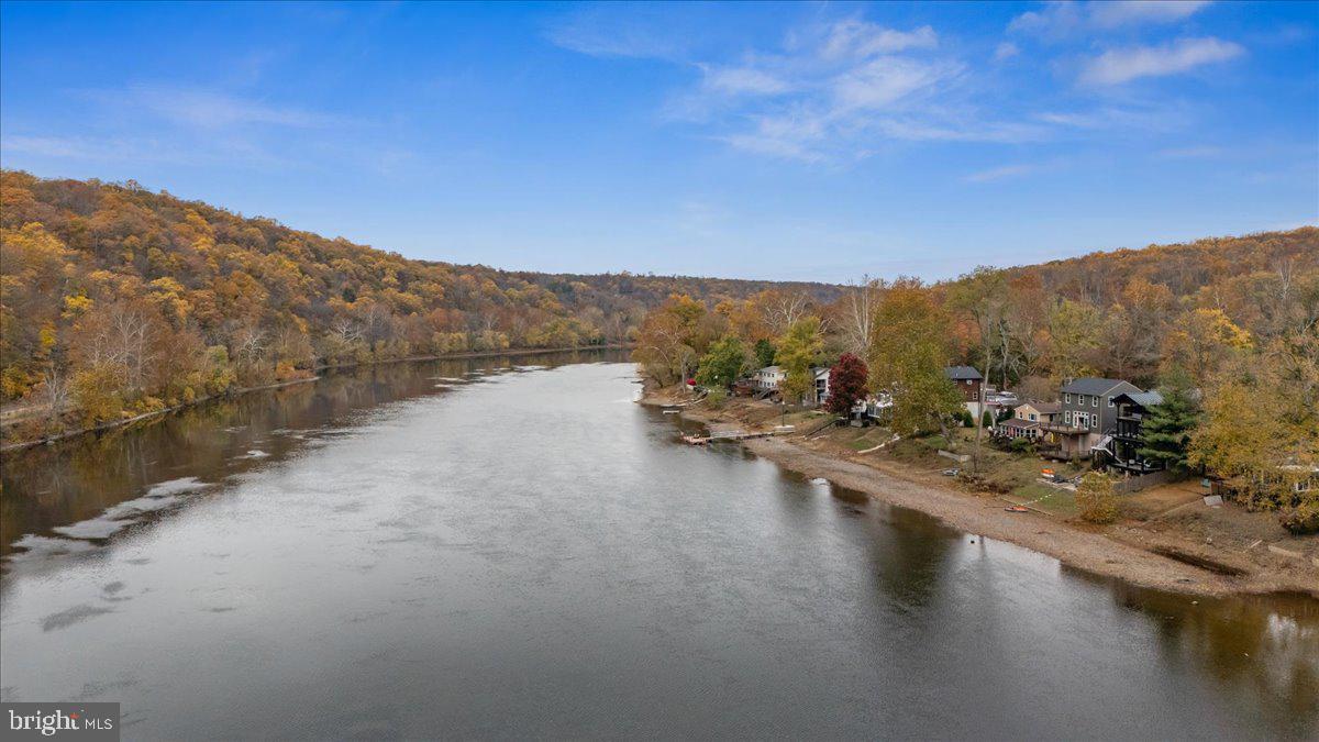 159 Byram Lane Stockton, NJ 08559 - Photo 5 of 62 a view of a lake with mountain