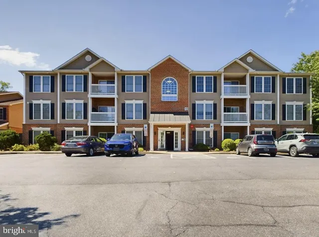 a car parked in front of a brick building