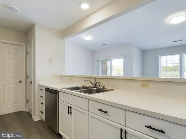 a kitchen with a sink and cabinets