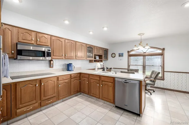 a kitchen with a sink stove and microwave