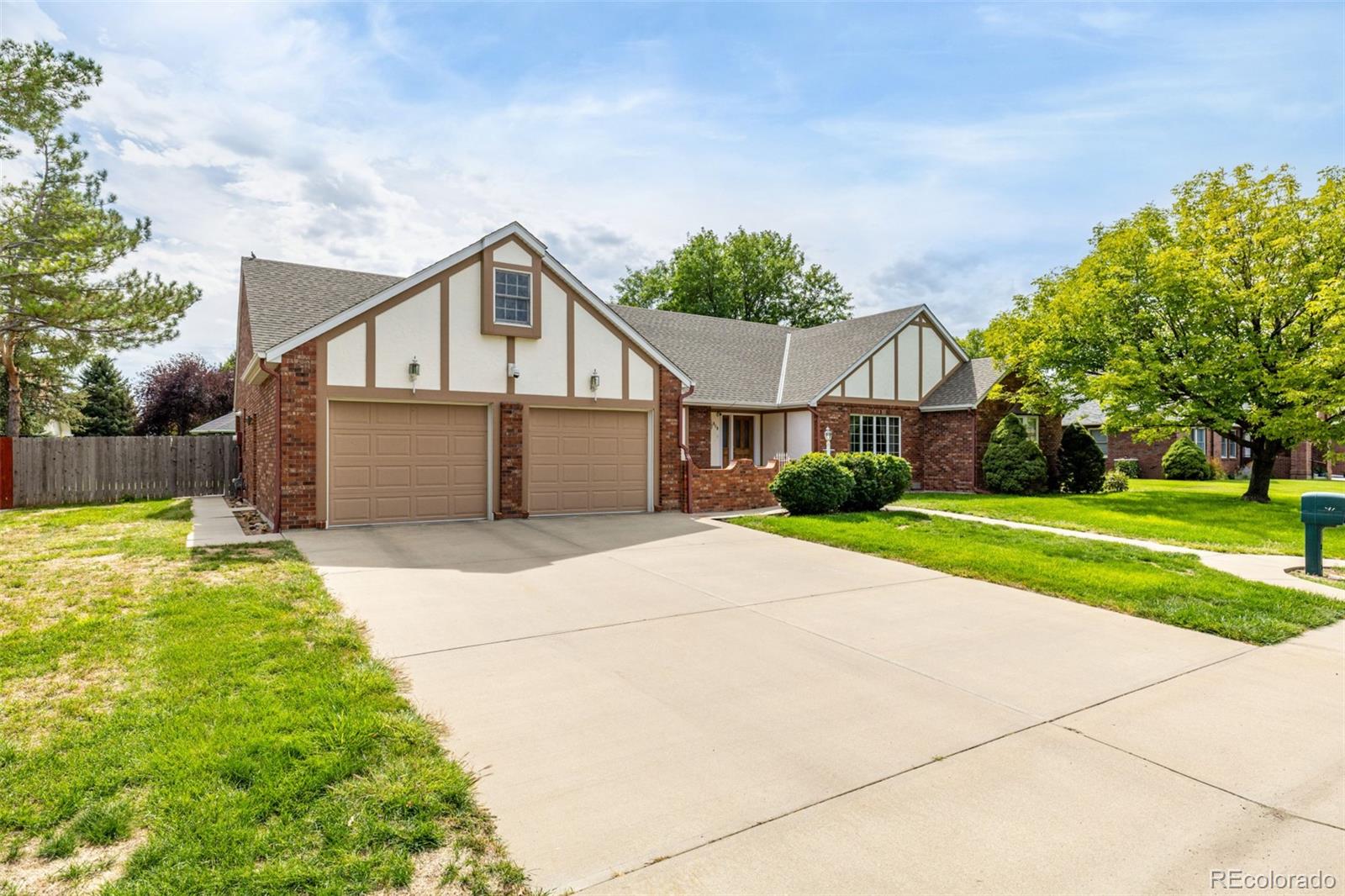 909 Fairhurst Street Sterling, CO 80751 - Photo 3 of 50 a view of a house with a yard