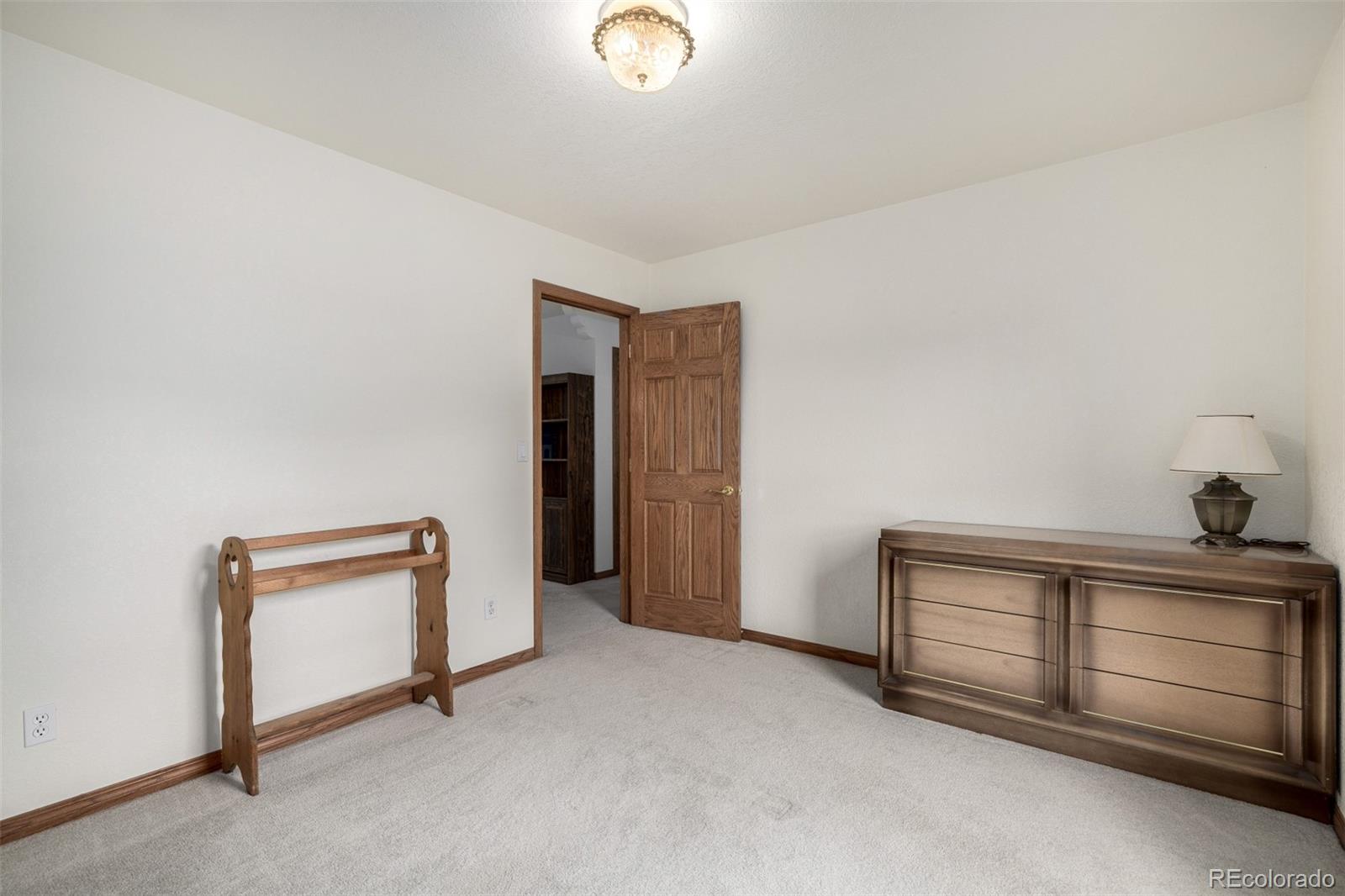 909 Fairhurst Street Sterling, CO 80751 - Photo 35 of 50 a view of an empty room with a cabinet