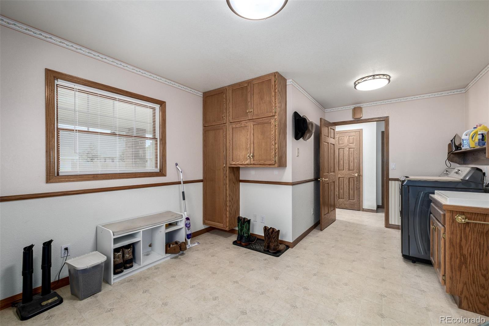 909 Fairhurst Street Sterling, CO 80751 - Photo 38 of 50 a view of a storage & utility room with a window