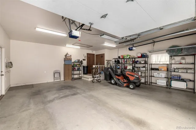 a view of a garage with a bike and white walls