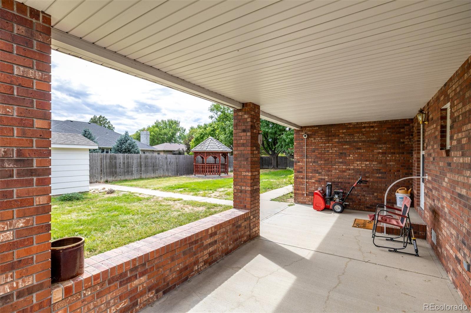 909 Fairhurst Street Sterling, CO 80751 - Photo 41 of 50 a view of yard from deck with patio