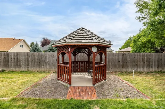a view of a dinning table and chair in the patio