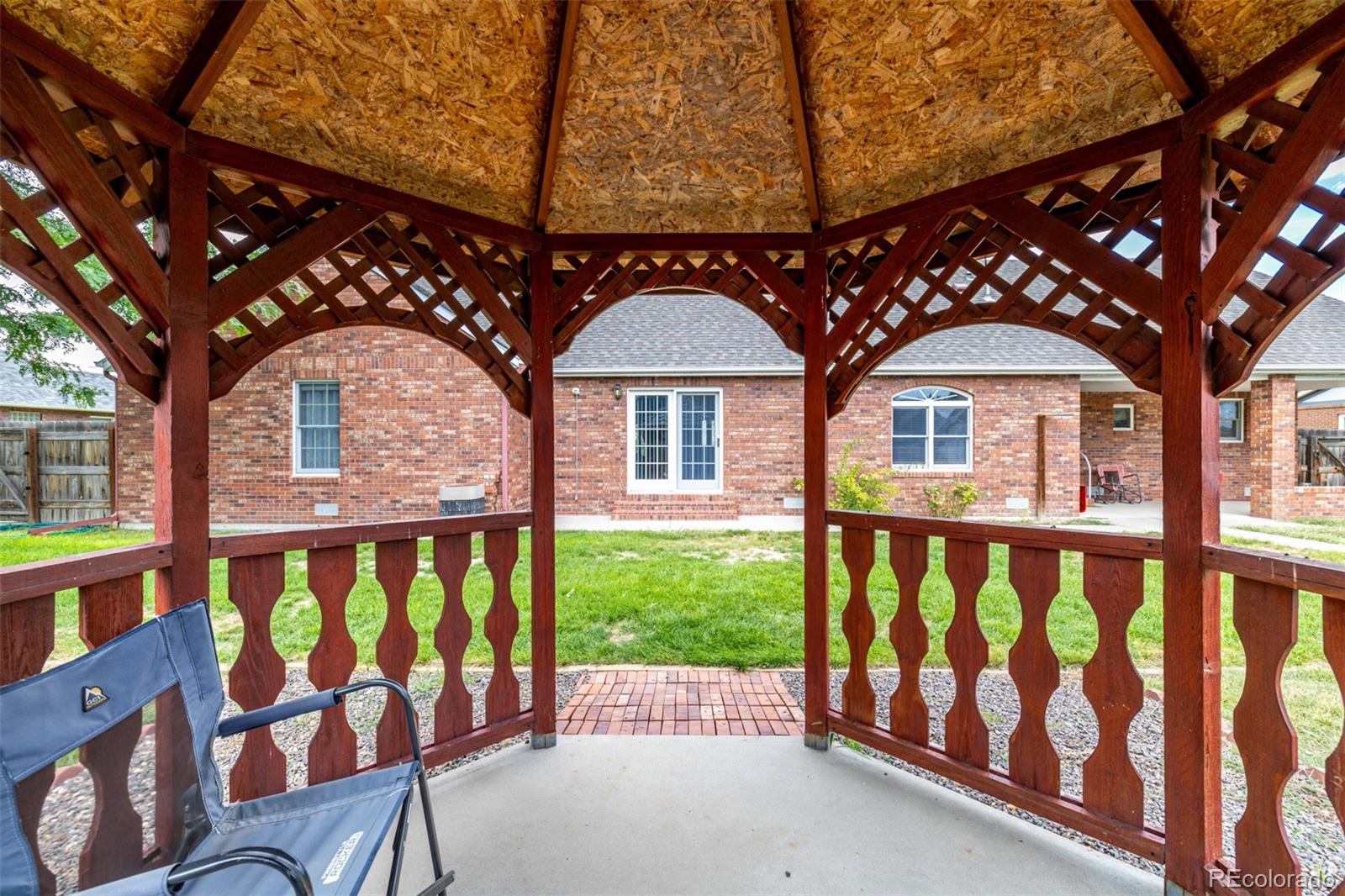 909 Fairhurst Street Sterling, CO 80751 - Photo 46 of 50 a front view of a house with garden