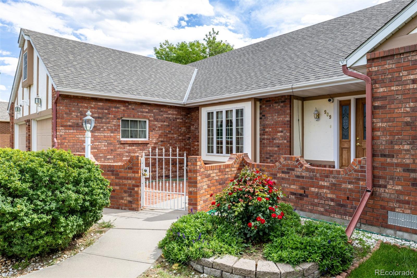 909 Fairhurst Street Sterling, CO 80751 - Photo 8 of 50 a front view of a house with a porch